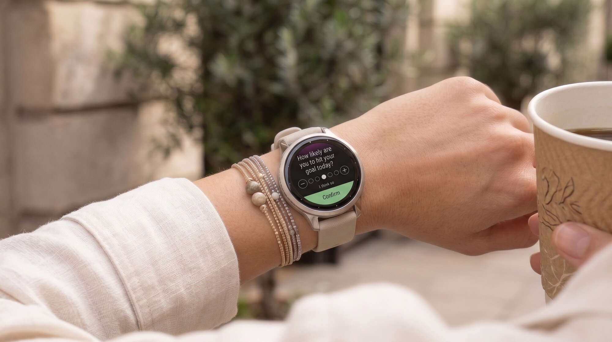 Participant wearing a Garmin smartwatch displaying an Engage survey prompt